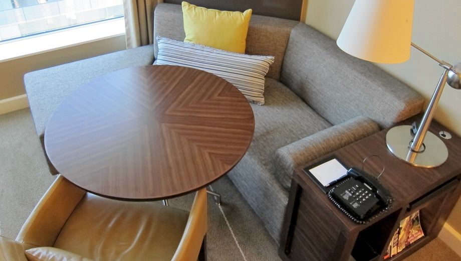 This hotel (Melbourne's Grand Hyatt) doesn't think you need a desk: their new executive rooms have a corner sofa and table instead. What do you reckon?