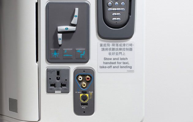 A multi-plug AC socket for laptops, USB socket for recharging smartphones and iPads, and 'iPod Connectivity Cable' port (CX cabin staff will loan out the special cables which have the more familiar flat Apple connector at the other end)