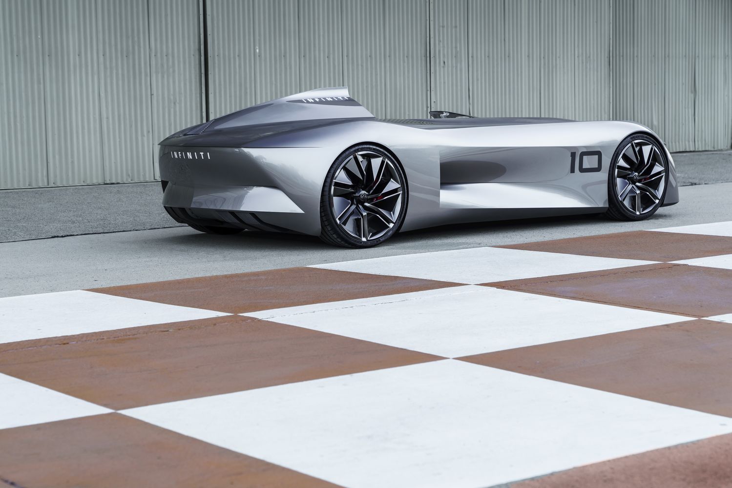 Infiniti's Prototype 10 concept blends futuristic long-range hybrid tech with a single-seat 'retro racer' design.
