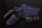 Grant's prêt-à-porter PJs borrow subtle cues from the Qantas uniforms such as a dusky French navy, while the matching slippers incorporate a flash of 'Qantas red'.
