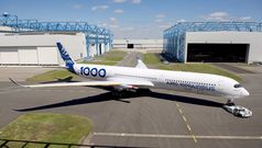 Airbus rolls out first A350-1000