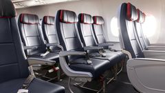 American Airlines cuts Main Cabin Extra upgrades for Qantas