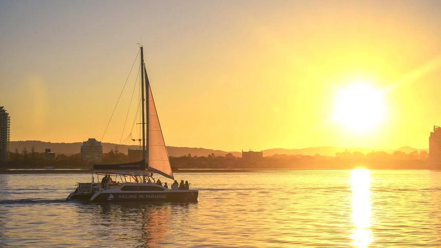 Raise a glass to the sunset with Sailing in Paradise.