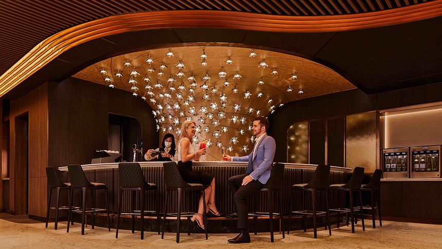 Sidle up to the first class bar for a pre-flight toast.