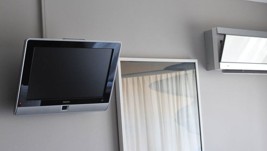 TV in the bedroom with the split-system air conditioner.