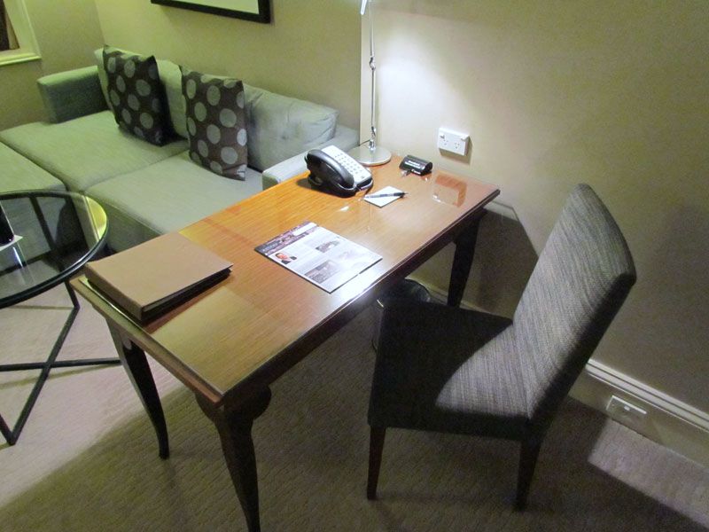 The desk, while not ergonomic, would work well for a couple of hours of work -- or more if you swap with the sofa.