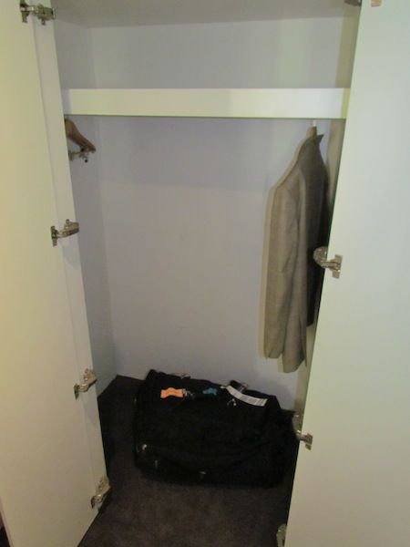 The only cupboard big enough for a suitcase is in the living/working area.