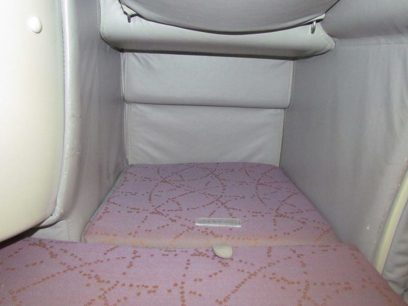 The footwell storage area is useful when in seat mode, and is where your feet end up when your seat turns into a bed.