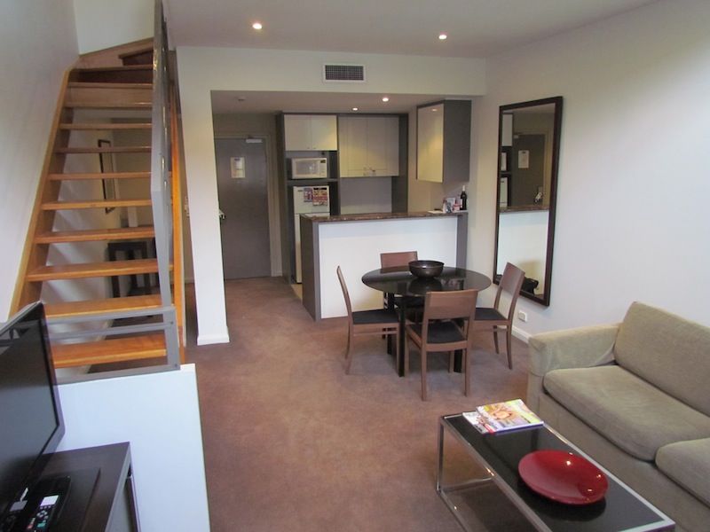 Stairs lead up to the open-plan bedroom, plus the bathroom.