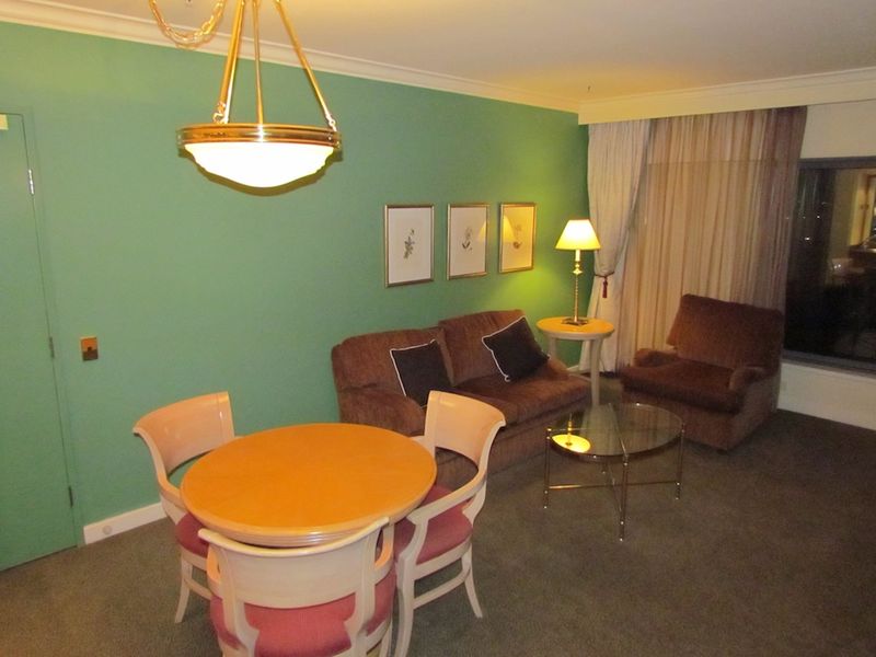 The good-sized living room was well-equipped with furniture, although it was a little tired.