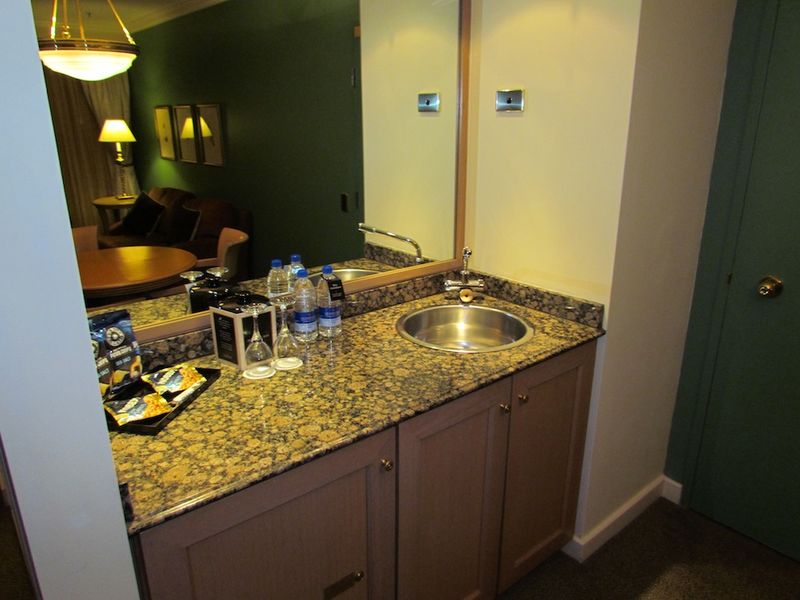 Relaxing with a glass of something from the stone-topped bar?