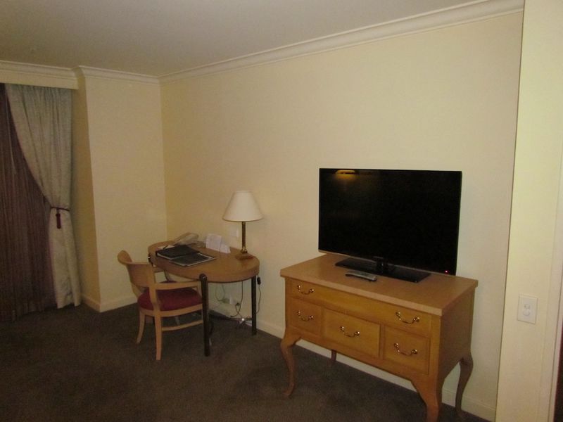 The second large flatscreen TV is in the living area.