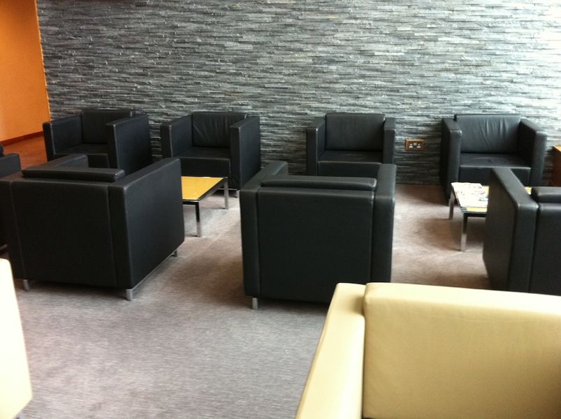 The main seating area is comfortable, and the slate wall behind lends an elegant air to the place.