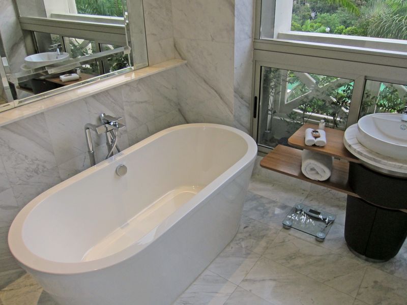Chill in the deep soaking tub and watch one of Singapore's regular thunderstorms pass overhead.
