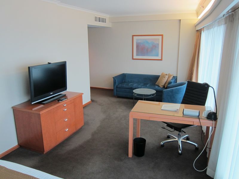 The room is surprisingly well-sized, although the TV is in an odd place.