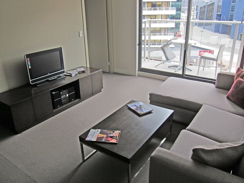 It's a tossup whether the best spot for chilling out is on the L-shaped sofa or out on the balcony.