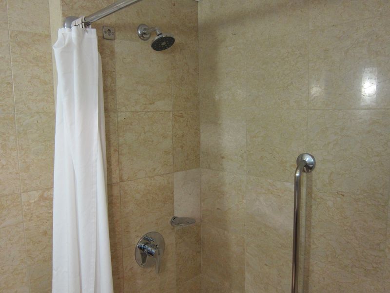 A shower-over-bath with just a regular shower head is below par for this class of hotel.
