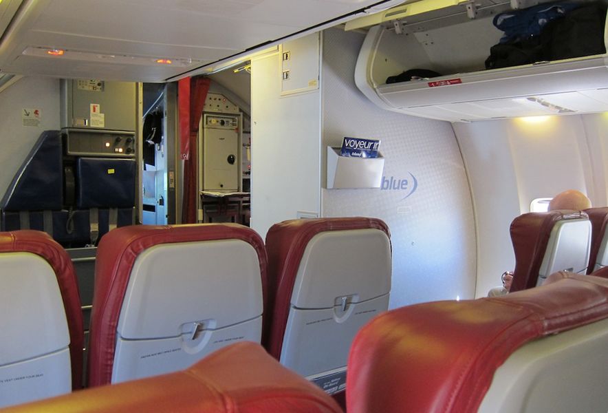 As a Velocity Gold frequent flyer, I was able to pick row 3, which is like Premium Economy but without the extra service.