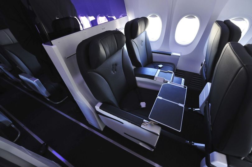 Here's what business class on Virgin's 737s looks like: business-like, with a funky purple divider inspired by sister airline Virgin America.