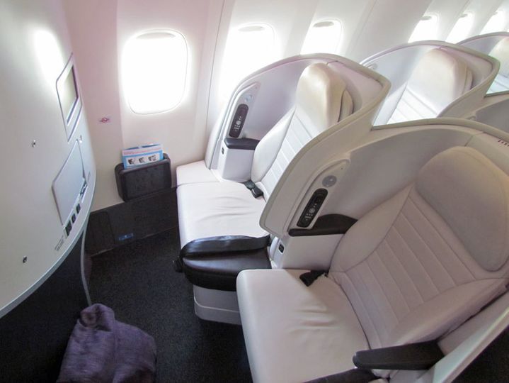 Air New Zealand's unique Spaceseats are some of the roomiest premium economy seats around. And who doesn't like a purple ottoman beanbag?