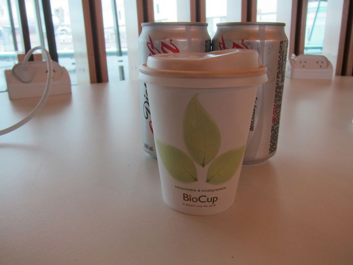 The coffee comes in biodegradable go-cups, which you're allowed to take on the plane.