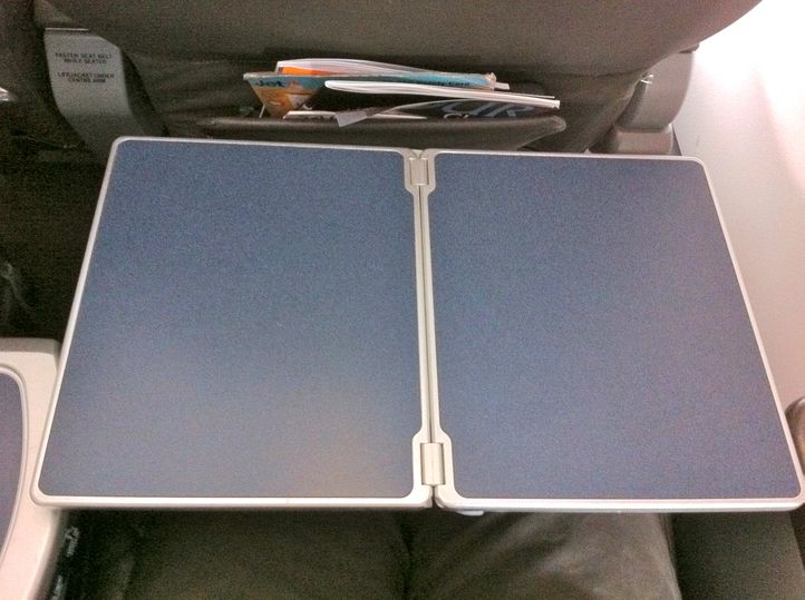 The wide and deep tray table has ample room for BYO entertainment such as a laptop