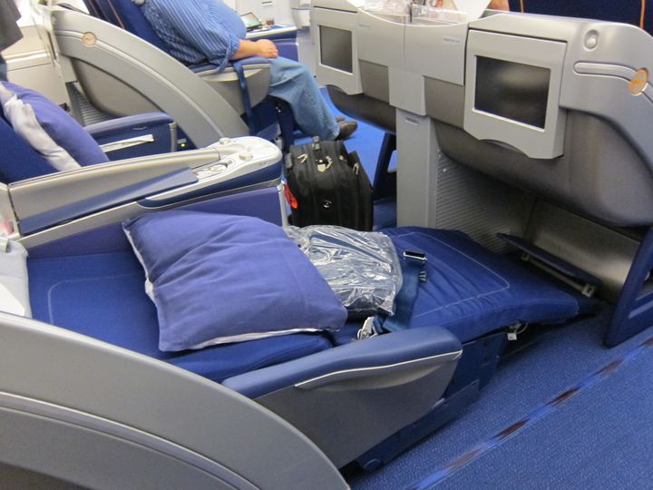Lufthansa's old angled-flat business class seat is really uncomfortable for any sleeping position that isn't on your back, since the seat support falls away below the knee.