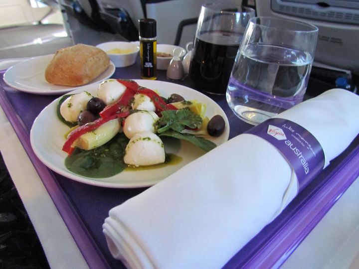 Hand-dressed bocconcini with olives, capsicum and baby spinach: that's the kind of good, simple food that works in the air.