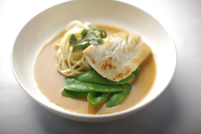 Higgins explains that the green vegetables in this snapper with coconut milk and garam masala are blanched on board, keeping them fresh and crunchy, rather than being baked to limpness in an oven.