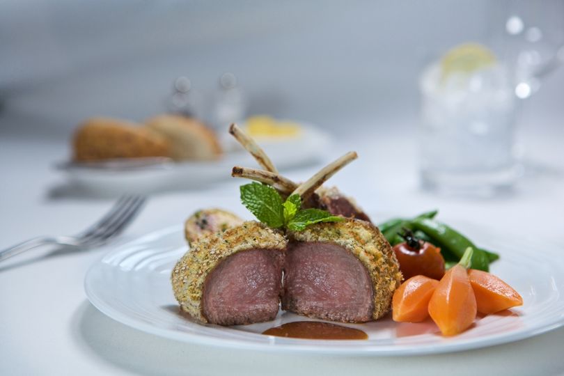 Emirates' business class meal offerings include dishes like this rack of lamb. Better than an orange and a cup of coffee...