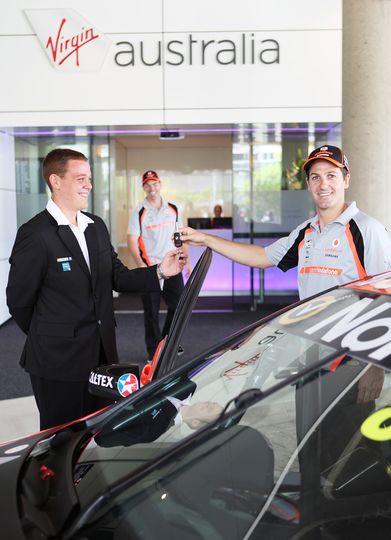 Jamie Whincup trustingly hands over the keys to his V8 to Virgin's Brisbane valet