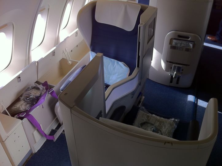 Business class upstairs on many 747s means you also get a side storage bin for your carry-on bag.