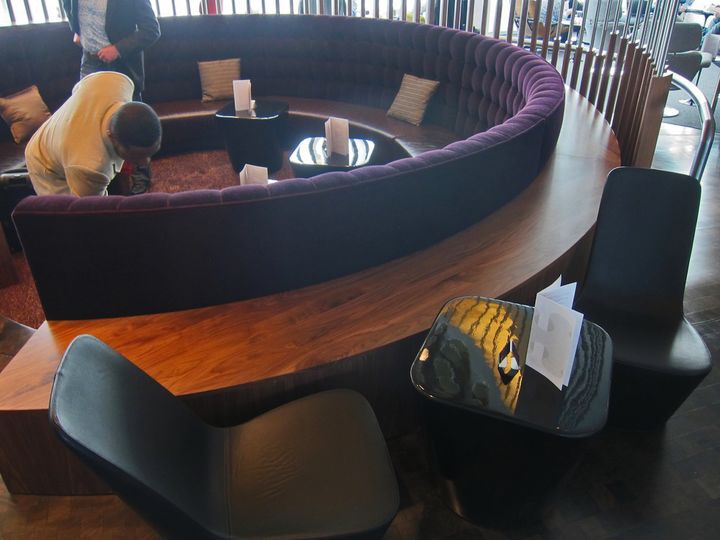 You can eat anywhere in the lounge: just pick a spot and grab the menu.