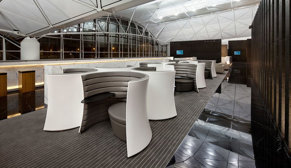 Solus chairs in The Wing lounges lack the perspex screen at the top due to airport fire regulations