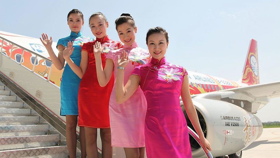 The colourful Sichuan Airlines crew can brighten even the foggiest Sydney day