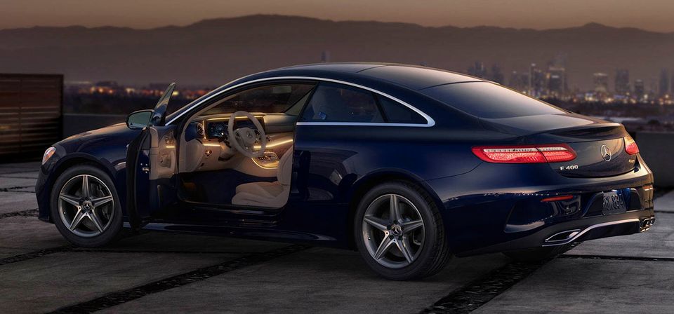 The interior of the E400 is cased in ambient lighting, brushed wood, and new, natural leathers