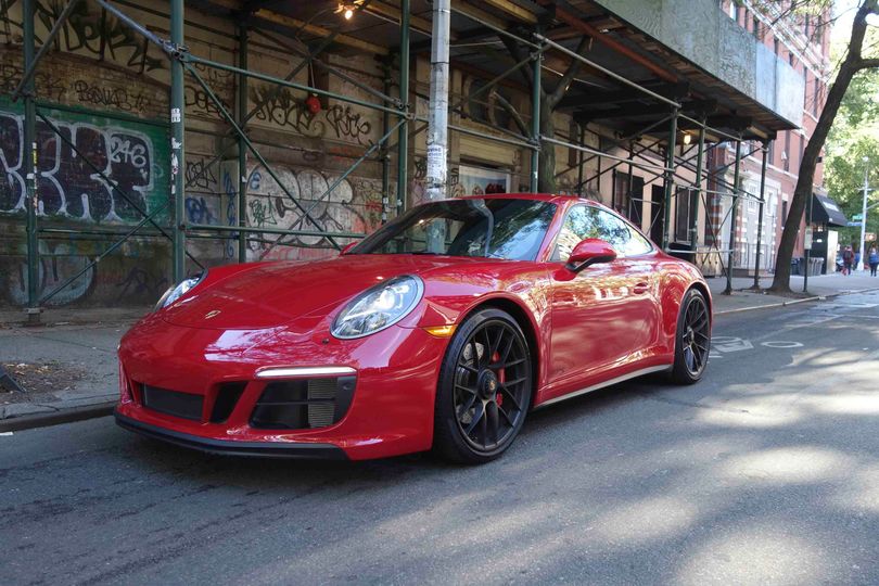 The carmine red Porsche 911 GTS is a crowd-magnet made for smartphone snaps and envious selfies
