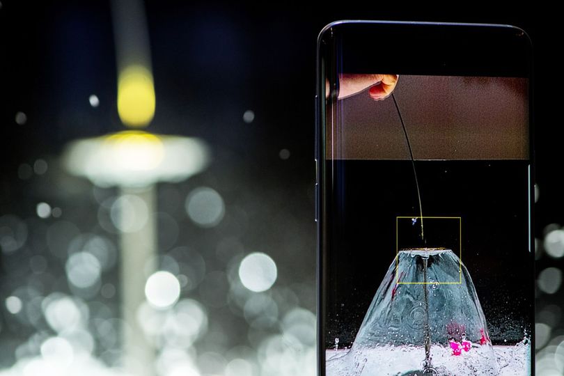 The Galaxy S9 smartphone captures a water balloon being burst with a pin to demonstrate the super slow-motion recording capability.