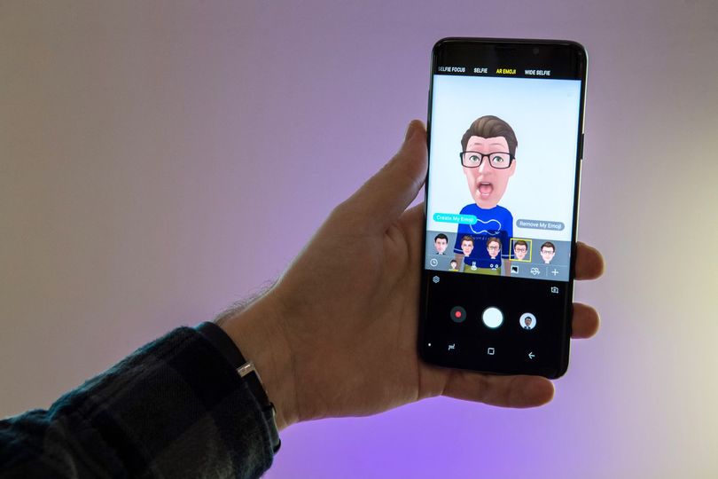 An animated emoji is displayed on-screen as a user demonstrates the augmented reality-based emoji capability of the Galaxy S9 smartphone.