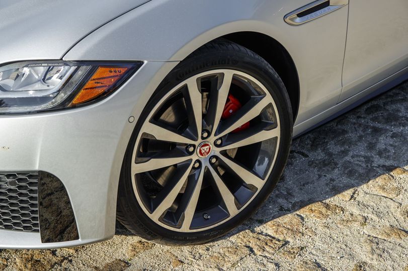 Twenty-inch alloy wheels come standard, as do red brake calipers, twin exhaust, and a rear wing spoiler.