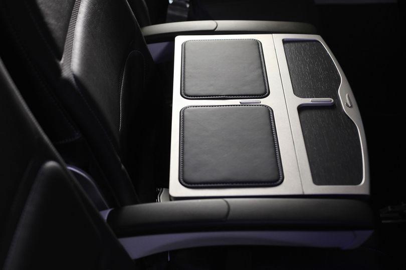 British Airways' Club Europe business class blocks off the middle seat with a tray table.