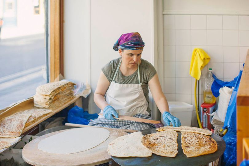 Oversized, freshly made flatbreads are the draw at this Broadway Market mainstay.