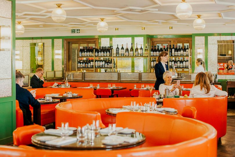 Stylish burnt-orange booths are a luxurious respite inside Fortnum & Mason’s famed department store.