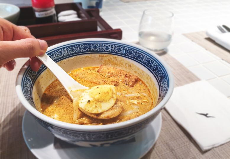Dig in to a bowl of laksa for that last taste of Singapore before you depart.