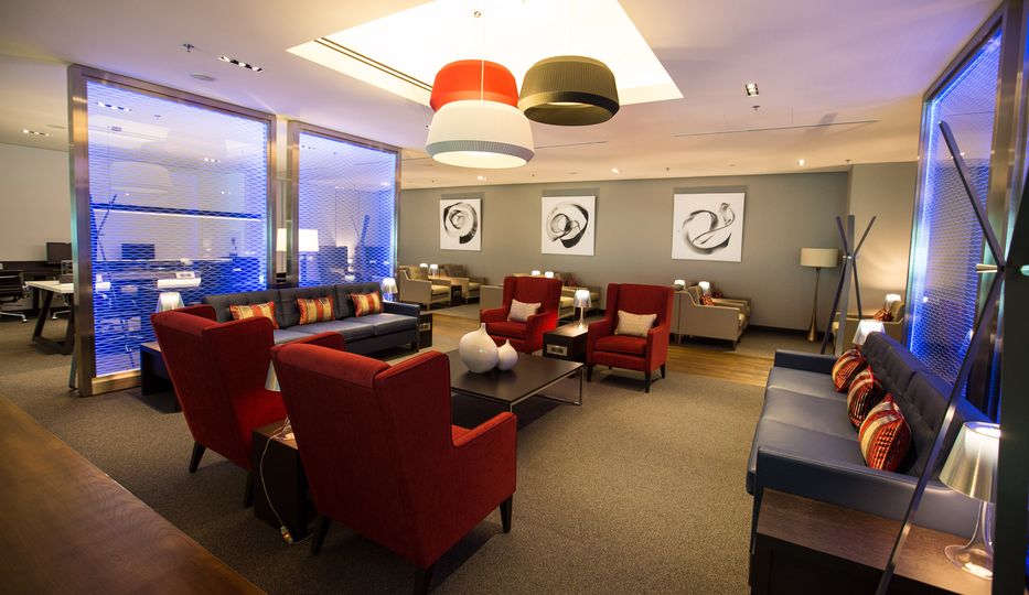 Head to the very rear of the BA lounge, behind that blue-lit glass panel, for a dedicated working zone.
