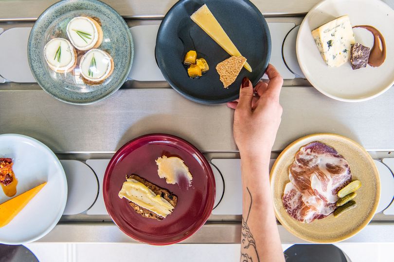 Dishes on the conveyor belt at Pick & Cheese.
