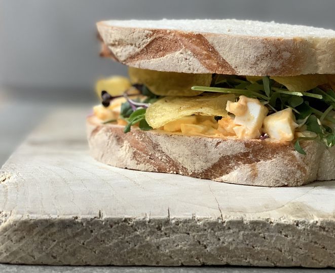 Burford brown eggs, miso mayonnaise, truffle crisps and salad cress at Sons + Daughters.