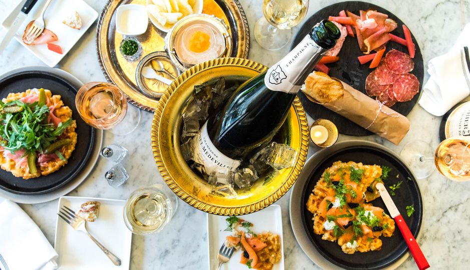 Food – and one of over 100 varieties of Champagne – from the coming Riddler NYC.