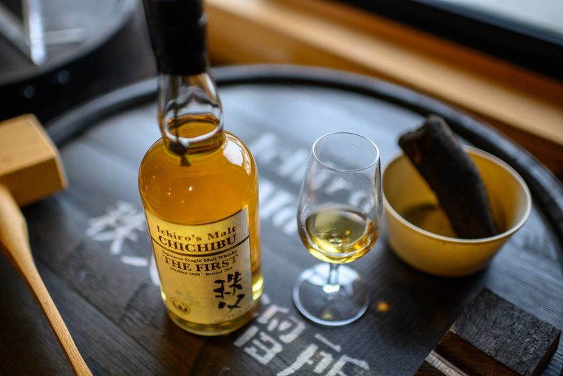 Ichiro&rsquo;s Malt from Chichibu Distillery, atop one of the barrels it was aged in.