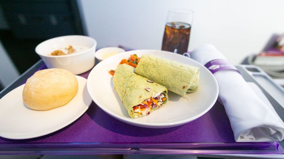 Business class passengers feeling a little peckish will have to buy menu items such as a salad wrap.
